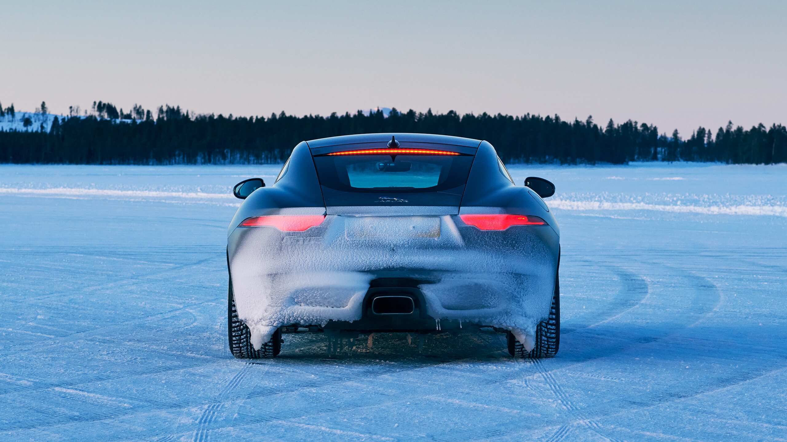 Jaguar FTYPE Parked Through A Road Covered In Ice